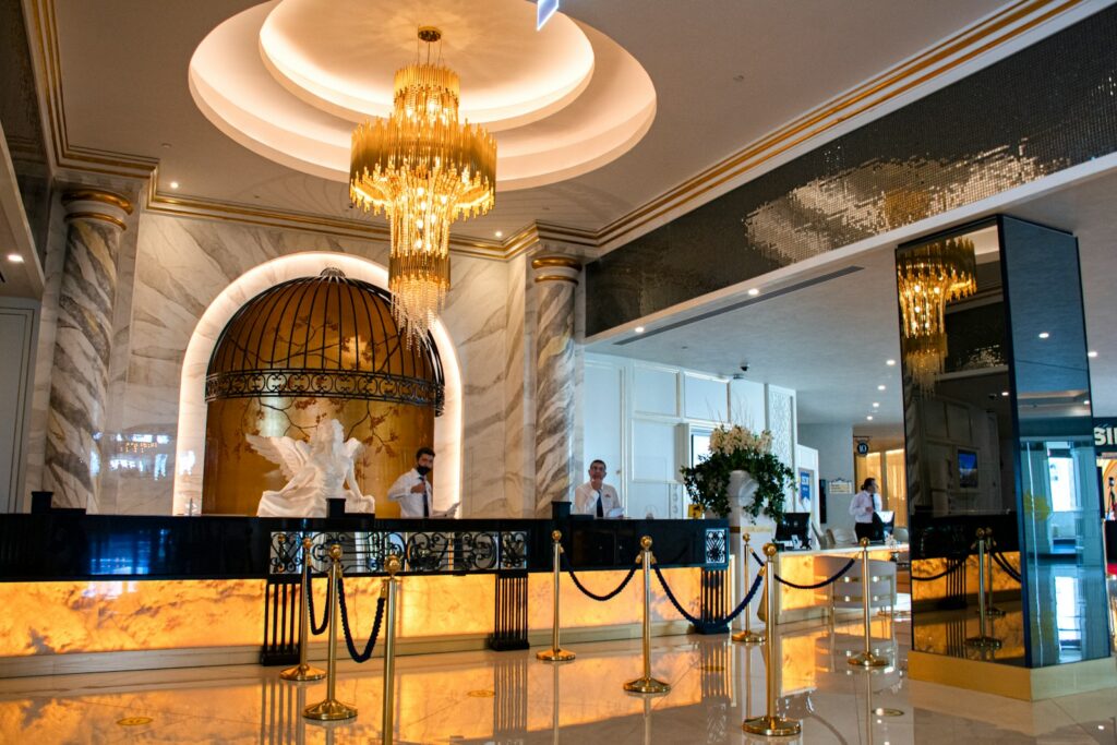 Photo by Oswald Elsaboath gold chandelier on white ceiling